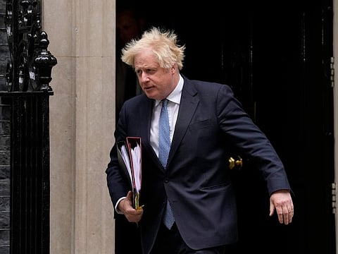 British Prime Minister Boris Johnson leaves 10 Downing Street to attend the weekly Prime Minister's Questions at the Houses of Parliament, in London, Wednesday, May 25, 2022.