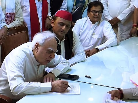 Kapil Sibal files his nomination for Rajya Sabha elections as an Independent candidate after resigning from Congress in the presence of Samajwadi Party chief Akhilesh Yadav and Rajya Sabha MP Ram Gopal Yadav, in Lucknow on Wednesday, May 25, 2022.