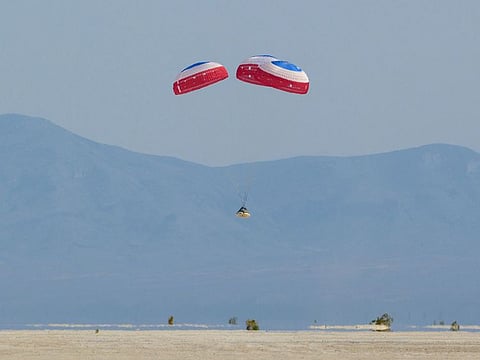 In this handout image courtesy of NASA, Boeing’s CST-100 Starliner spacecraft lands at White Sands Missile Range’s Space Harbor, May 25, 2022, in New Mexico.