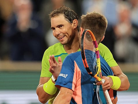 Rafael Nadal (left) with France's local hope Corentin Moutet after winning his second round match late on Wednesday.
