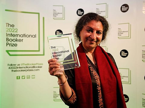 Author Geetanjali Shree poses with the 2022 International Booker Prize award for her novel 'Tomb of Sand' in London, Thursday, May 26, 2022.