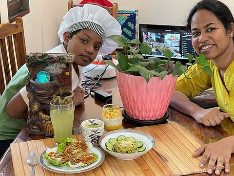 Kanav Mittal with his mum and his creations