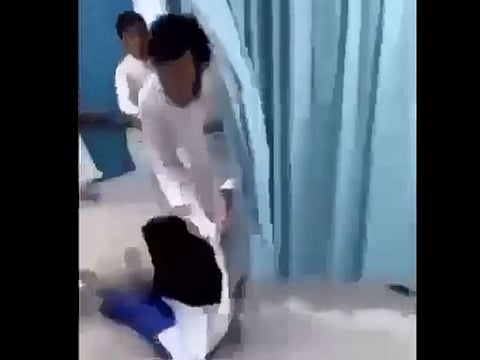 The man was seen in the video dragging the woman on the floor as others try to stop him. The suspect, identified as a Saudi, was arrested later and referred to prosecution, police said.