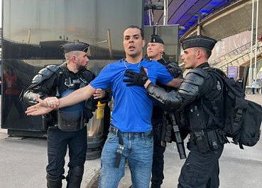 French police arrest a man outside Stade de France before Champions League Final.