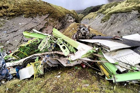 This handout photograph taken on May 30, 2022 and released by the Nepal Police shows the wreckage of a Twin Otter aircraft, operated by Nepali carrier Tara Air, laying on a mountainside in Mustang, a day after it crashed.