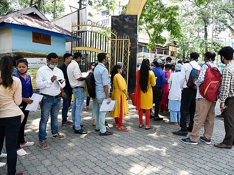 Job applicants in queue to submit forms at Mahendra Mohan Choudhury Hospital (MMCH) in Guwahati, Assam, India