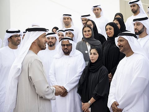 Sheikh Mohamed with the ADNOC team.