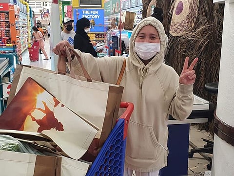 A shopper with reusable bags on Wednesday, the first day of the implementation of the 'Abu Dhabi Single-Use Plastic Policy'