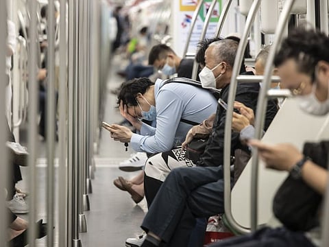 Commuters in a subway in Shanghai on June 1, 2022. China's financial capital reported its fewest Covid-19 cases in almost three months as residents celebrated a significant easing of curbs on movement, while some companies took a more cautious approach, maintaining some restrictions in factories.