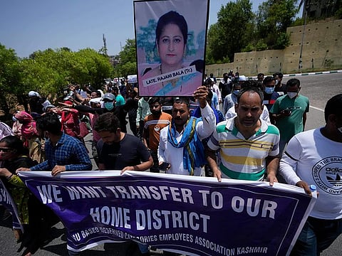 Employees of Jammu and Kashmir Teachers Association shout slogans during a protest against the killing of colleague Rajini Bala in Jammu, on June 2, 2022.