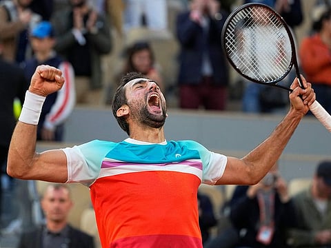 Croatia's Marin Cilic celebrates winning his quarter-final match against Russia's Andrey Rublev.