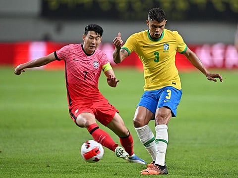 Brazil's defender Thiago Silva (right) fights for the ball with South Korea's Son Heung-min during the friendly at Seoul World Cup Stadium in Seoul on Thursday.