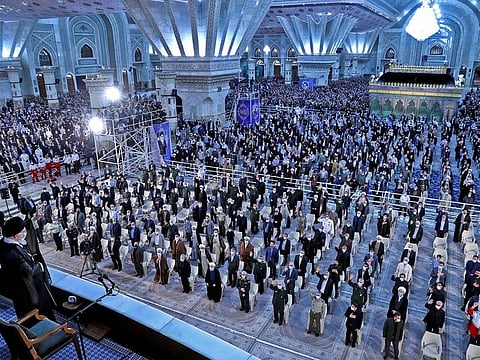 Khamenei gestures during the 33rd anniversary of the death of the leader of Iran's 1979 Islamic revolution, Ayatollah Ruhollah Khomeini, at Khomeini's shrine in southern Tehran on June 4, 2022.