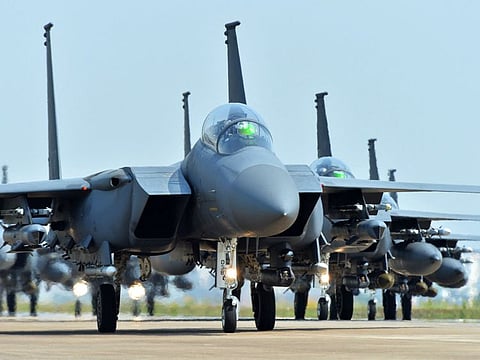 South Korean Air Force F-15K fighter planes demonstrating an "Elephant Walk" as they taxi down a runway during an exercise at an undisclosed air base in South Korea.
