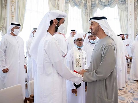 Sheikh Mohamed greets Emirati physicist Ahmed Al Muhairi.