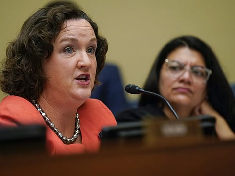 Representative Katie Porter, a Democrat from California, speaks as Representative Rashida Tlaib, a Democrat from Michigan, listens during a House Oversight and Reform Committee hearing in Washington on the need to address the gun violence epidemic.