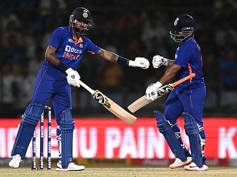 India captain Rishabh Pant (right) and teammate Hardik Pandya bump fists during the first Twenty20 international against South Africa at the Arun Jaitley Stadium in New Delhi. The second match of the series takes place tomorrow at the Barabati Stadium, in Cuttack.