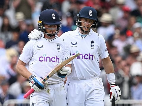Joe Root (right) comforts England's Ollie Pope as the latter is dismissed on a classy 145 against New Zealand on third day of the second Test at Trent Bridge cricket ground in Nottingham on Sunday.