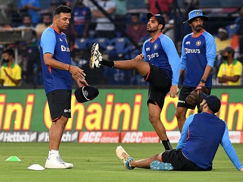 India's head coach Rahul Dravid (left) speaks with his players. India face South Africa tomorrow in the third T20 trailing 2-0 in the five-match series.