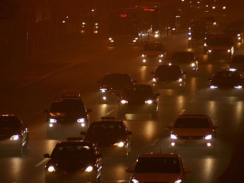 Cars drive in heavy smog during a polluted day in Beijing, China,