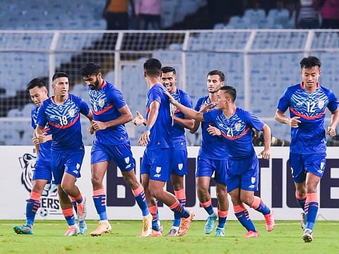Members of Indian national team look a happy bunch after one of their four goals against Hong Kong on Tuesday.
