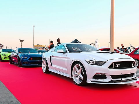 The July 2 parade by men in kanduras will feature 100 supercars.