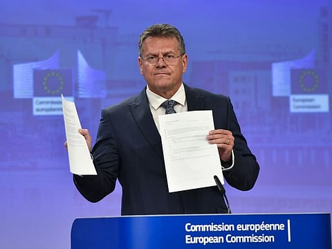 European Commissioner for Inter-institutional Relations and Foresight Maros Sefcovic holds up documents as he speaks during a media conference at EU headquarters in Brussels, on June 15, 2022.