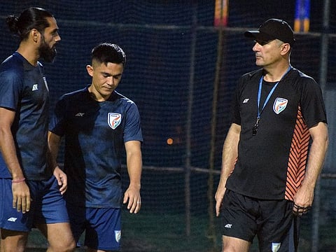 Indian captain Sunil Chhetri along with teammate Sandesh Jhingan and head coach Igor Stimac during a practice session at the Salt Lake Stadium in Kolkata.