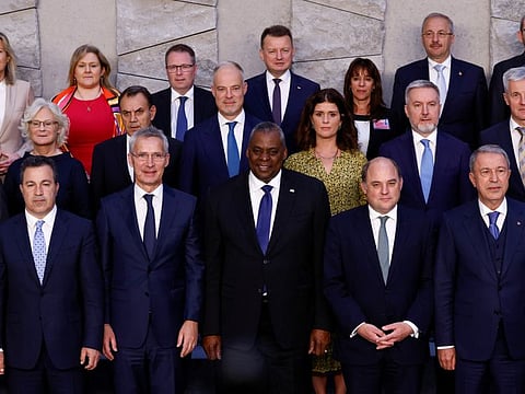 Nato Secretary-General Jens Stoltenberg poses for a family photo with Nato defence ministers during a meeting at the Alliance's headquarters in Brussels, on June 16, 2022.
