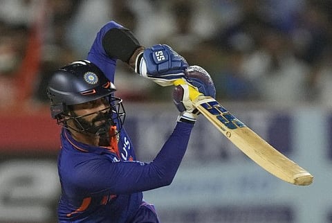 India's Dinesh Karthik plays a lofted drive during his maiden half-century in the fourth Twenty20 match against South Africa in Rajkot on Friday.