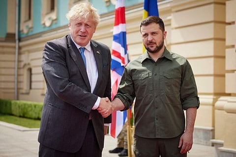 In this image provided by the Ukrainian Presidential Press Office, Ukrainian President Volodymyr Zelenskyy, right, and Britain's Prime Minister Boris Johnson, pose for a photo during their meeting in downtown Kyiv, Ukraine, Friday, June 17, 2022.
