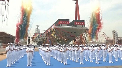 This screen grab made from video released by Chinese state broadcaster CCTV shows the launch ceremony of the Fujian, a People's Liberation Army (PLA) aircraft carrier, at a shipyard in Shanghai on June 17, 2022.