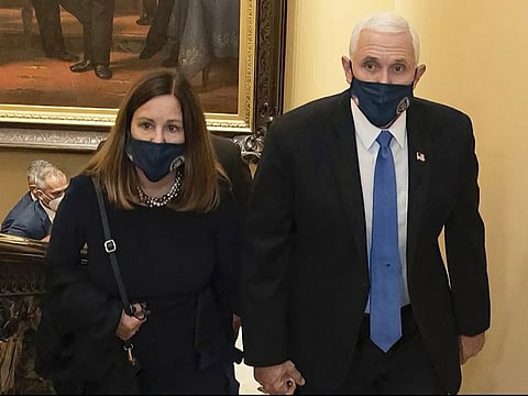 In this image from video released by the House Select Committee, Vice-President Mike Pence and his wife Karen walk at the Capitol on Jan 6, that the House select committee investigating the Jan. 6 attack on the US Capitol displayed Thursday, June 16, 2022, on Capitol Hill in Washington.