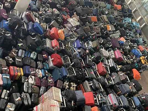 The piled-up suitcases at Heathrow on Friday.