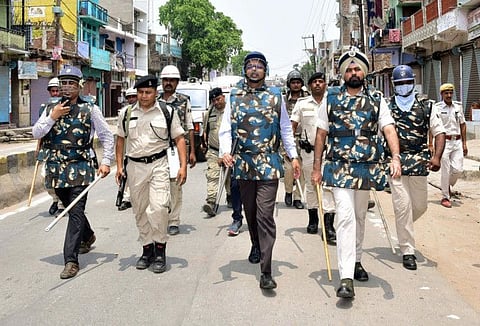 Patna District Magistrate Dr. Chandrashekhar Singh and Senior Superintendent of Police (SSP) MS Dhillon flag march as a precautionary measure during Bihar shutdown called to protest against the Agnipath Recruitment Scheme in Patna on Saturday.