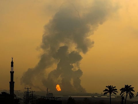 Fire erupts following an Israeli airstrike south of Gaza City on June 18, 2022.