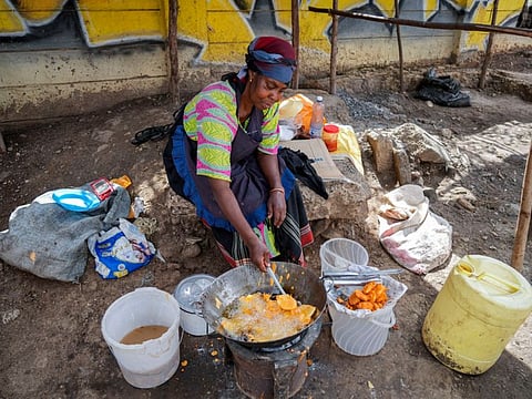 A woman fries potatoes in the low-income Kibera neighbourhood of Nairobi, Kenya. Russian hostilities in Ukraine are preventing grain from leaving the “breadbasket of the world" and making food more expensive across the globe, raising the specter of shortages, hunger and political instability in developing countries. Together, Russia and Ukraine export nearly a third of the world’s wheat and barley, more than half its sunflower oil and are big suppliers of corn.