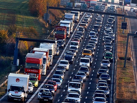 Cars and trucks queue on the highway A5 in Frankfurt, Germany Nov. 6, 2017. People across the world are confronted with higher fuel prices as the war in Ukraine and lagging output from producing nations drive prices higher.