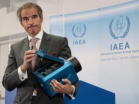 In this file photo taken on December 17, 2021 Director General of the International Atomic Energy Agency (IAEA) Rafael Mariano Grossi presents a surveillance camera at the agency's headquarters in Vienna, Austria.