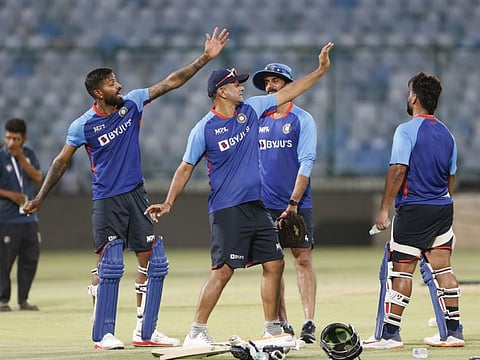 (From left) Indian all-rounder Hardik Pandya discusses a point over the bowling action with head coach Rahul Dravid with batting coach Vikram Rathore and skipper Rishabh Pant watching during a training session during the Twenty20 series against South Africa.