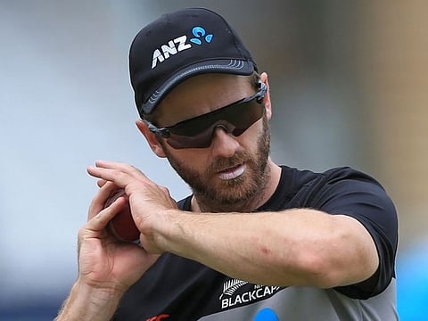 Kane Williamson catches a ball during a team training session in England. The New Zealand skipper will return home after the third Test, beginning on Thursday.