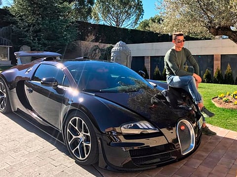 Better days... Ronaldo pictured with his Veyron, which has been involved in a crash in Majorca.