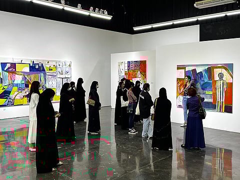 Students view NFT art at Zawyeh Gallery at Al Serkal Avenue as part of the Abu Dhabi programme