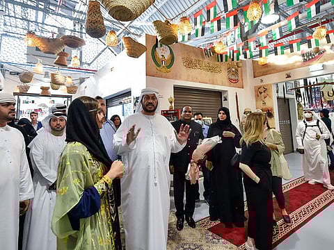 Emirati Naser Sulaiman, founder of Museum Hub, welcoming the first set of visitors to the new destination at Souk Al Mafra in Dubai on Wednesday evening.