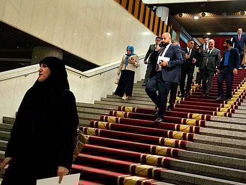Lawmakers arrive to attend a parliament session in Baghdad, on June 23, 2022.