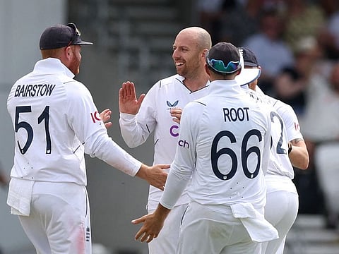 England's Jack Leach celebrates with teammates after taking the wicket of New Zealand's Henry Nicholls during the first day of the third Test at Headingley on Thursday.
