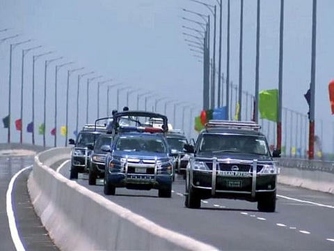 Bangladesh Prime Minister Sheikh Hasina travels in her convoy on the country's new landmark multipurpose 'Padma Bridge', which is inaugurated by her, on Saturday.