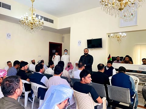 Afghan Consul General Masood Ahmad Azizi talking to community members during the special prayers held at the consulate in Dubai for earthquake victims.