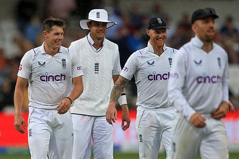 (From left) England's Matthew Potts, Stuart Broad, captain Ben Stokes and Jack Leach leave as rain stops play on day 3 of the third Test against New Zealand at Headingley Cricket Ground in Leeds, northern England.