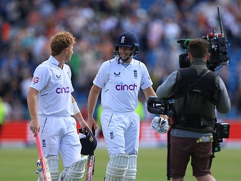 England's Joe Root and Ollie Pope after stumps.